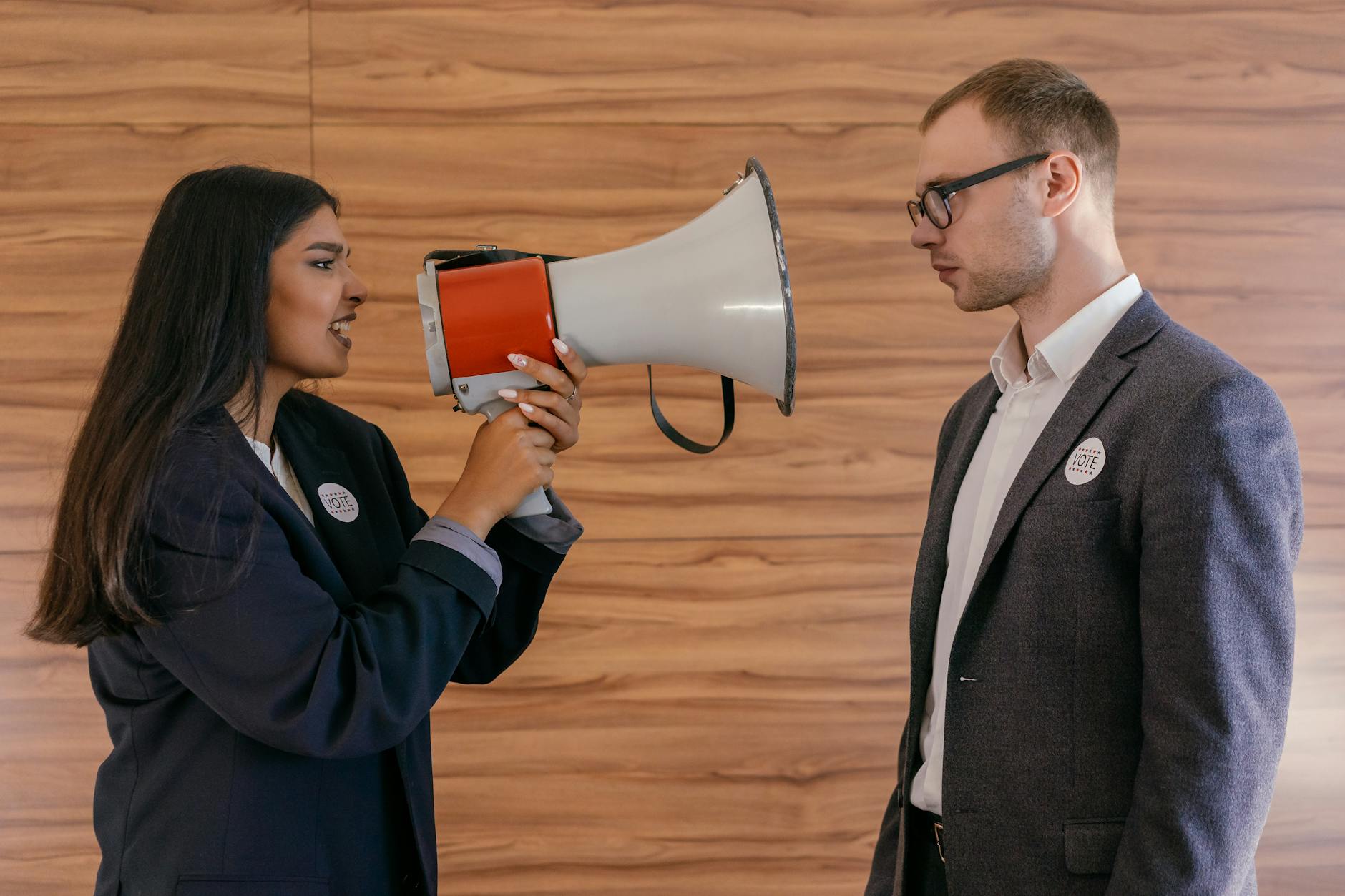politician holding loudspeaker